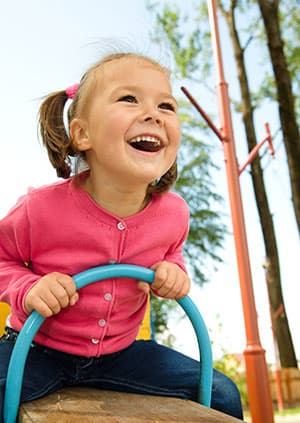 Girl on playground - Pediatric Dentist in Temple Hills, MD, and Richmond, VA